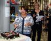 Lady Cosgrove, Friends' Patron, cuts the 25th anniversary cake